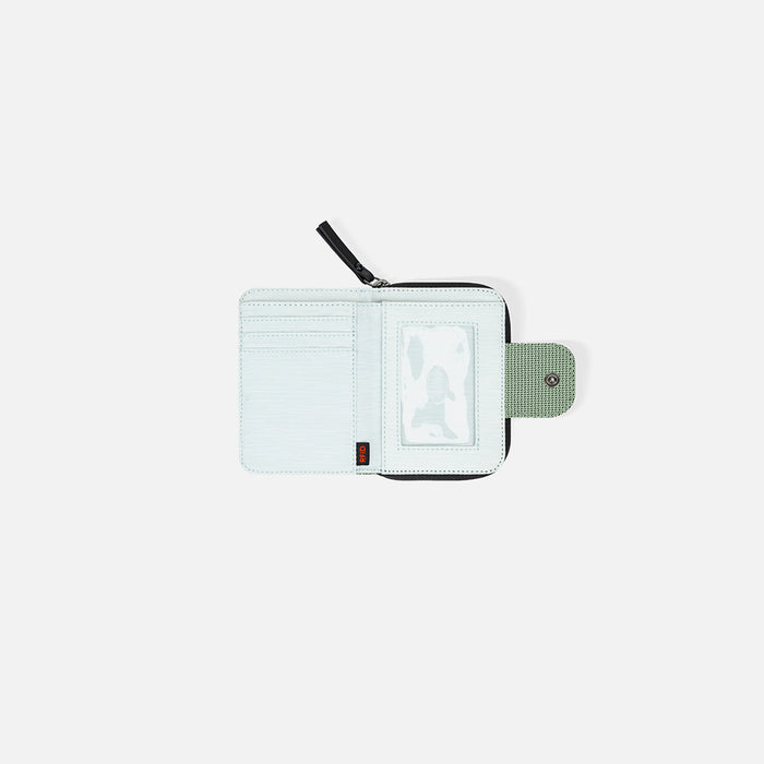 A Sherpani Barcelona Aloe Mist Green Anti-theft RFID Mini Wallet, above view showing inside wallet on white backdrop.  #color_aloe-mist-green