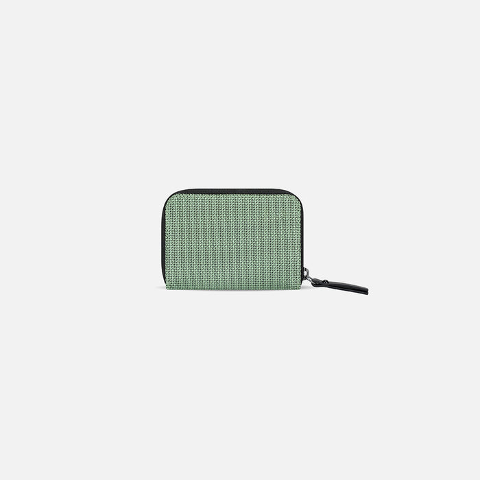 A Sherpani Barcelona Aloe Mist Green Anti-theft RFID Mini Wallet, back view on white background.  #color_aloe-mist-green