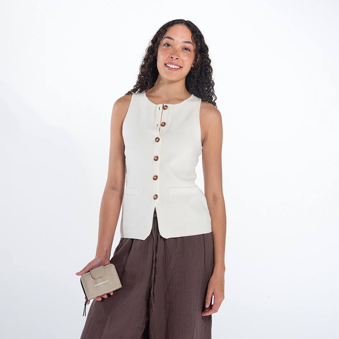 Woman holding a Sherpani Barcelona Straw Beige Anti-theft RFID Mini Wallet on white backdrop. #color_straw-beige