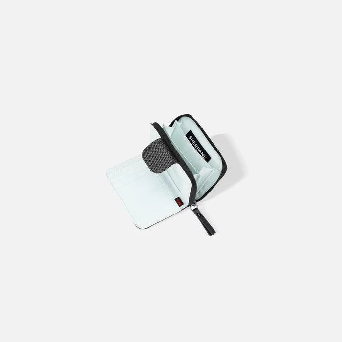 A Sherpani Barcelona Granite Anti-theft Mini Wallet, above view showing inside wallet on white backdrop.    #color_granite-grey