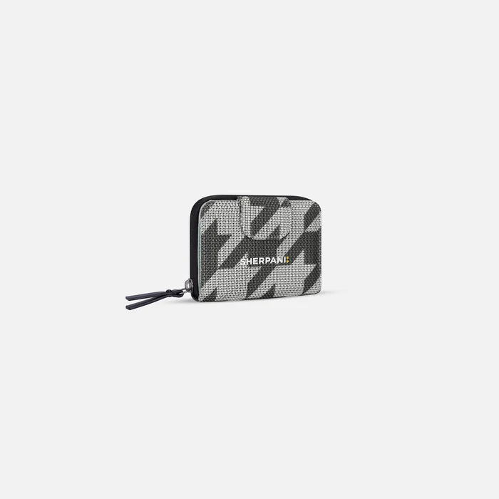 A Sherpani Barcelona Houndstooth Anti-Theft Mini Wallet, 3/4 view showing clasp on white background.  #color_houndstooth-print