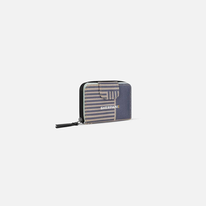A Sherpani Barcelona Passport Anti-Theft Mini Wallet, 3/4 view showing clasp on white background.  #color_passport-print