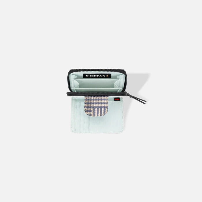A Sherpani Barcelona Passport Anti-theft Mini Wallet, above view showing inside wallet on white backdrop.    #color_passport-print