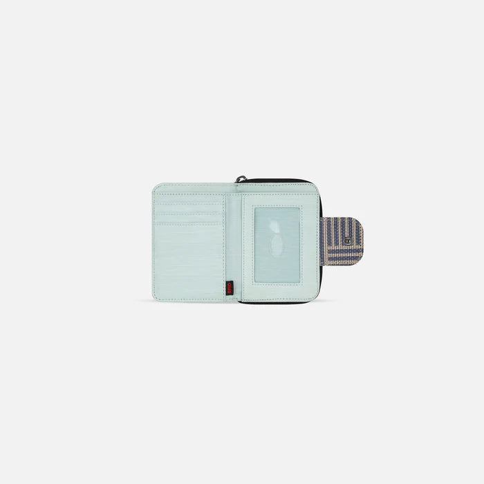 A Sherpani Barcelona Passport Anti-theft Mini Wallet, above view showing inside wallet on white backdrop.    #color_passport-print