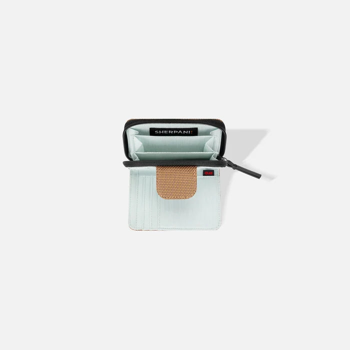 A Sherpani Barcelona Sand Anti-theft Mini Wallet, above view showing inside wallet on white backdrop.    #color_sand-tan
