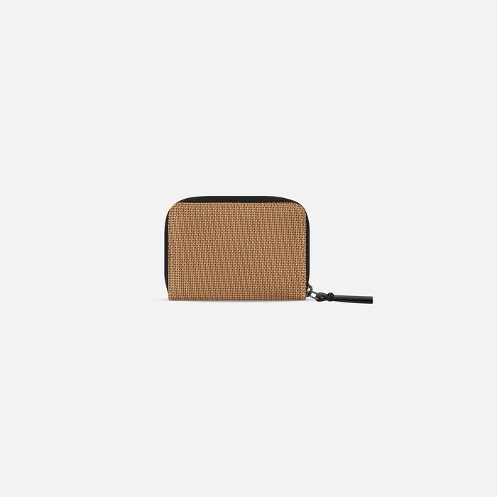 A Sherpani Barcelona Sand Anti-Theft Mini Wallet, back view on white background. #color_sand-tan