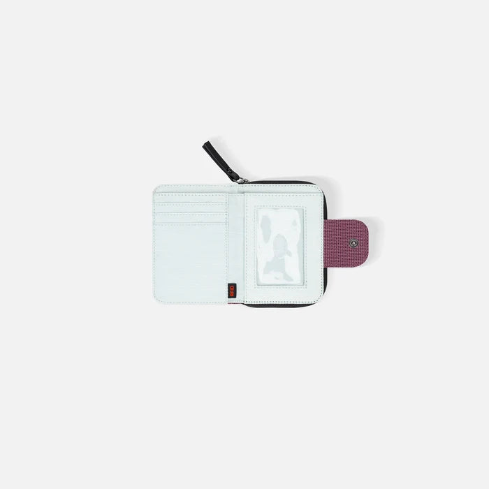 A Sherpani Barcelona Smoky Orchid Anti-theft Mini Wallet, above view showing inside wallet on white backdrop.   #color_smoky-orchid-pink