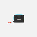 A Sherpani Barcelona Chromatic Black RFID Mini Wallet, front view showing clasp on white background. #color_chromatic-black