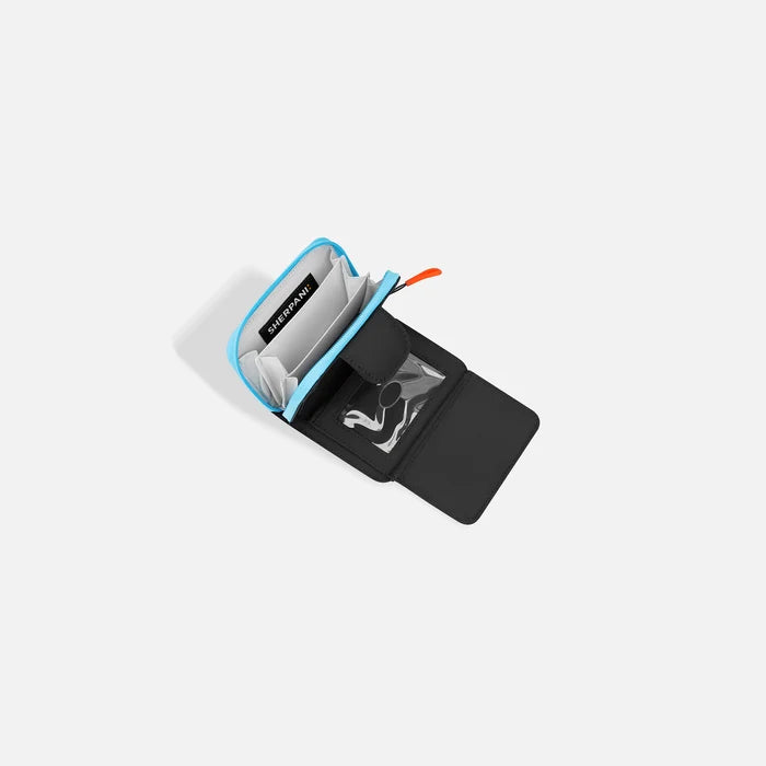 A Sherpani Barcelona Chromatic Black RFID Mini Wallet, above view showing inside wallet on white backdrop.  #color_chromatic-black