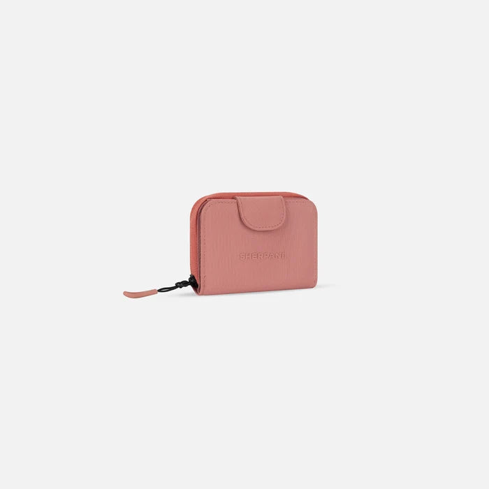 A Sherpani Barcelona Desert Pink RFID Mini Wallet, 3/4 view showing clasp on white background.  #color_desert-pink