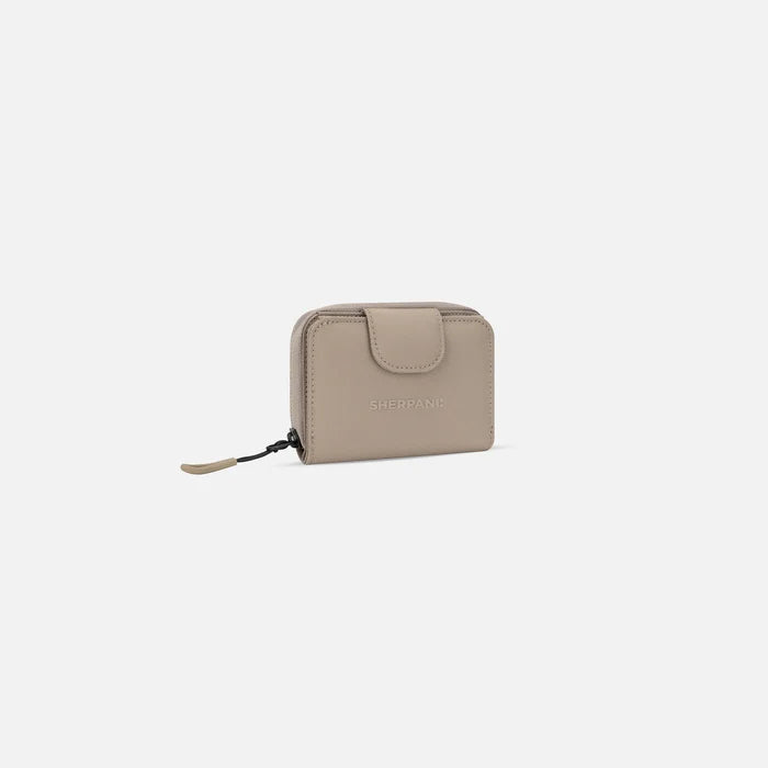 A Sherpani Barcelona Dune RFID Mini Wallet, 3/4 view showing clasp on white background. #color_dune-tan