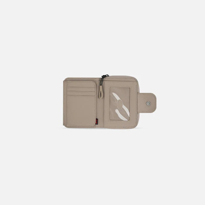 A Sherpani Barcelona Dune RFID Mini Wallet, above view showing inside wallet on white backdrop.  #color_dune-tan