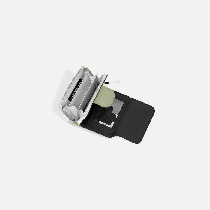 A Sherpani Barcelona Palm Green RFID Mini Wallet, above view showing inside wallet on white backdrop.  #color_palm-green