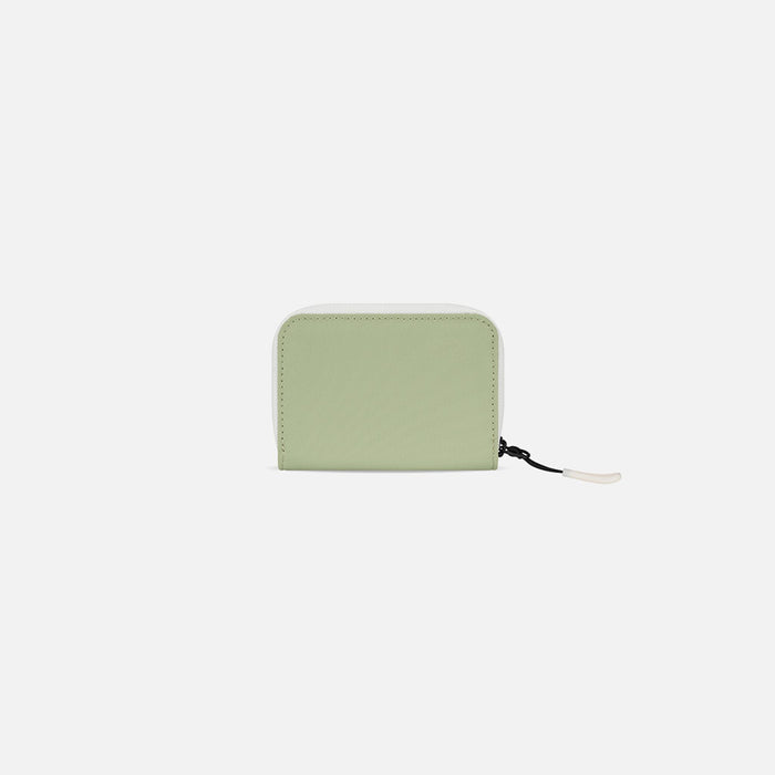 A Sherpani Barcelona Palm Green RFID Mini Wallet, back view on white background.   #color_palm-green