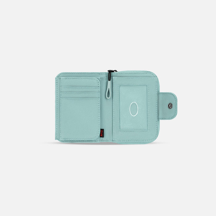 A Sherpani Barcelona Surf Blue RFID Mini Wallet, above view showing inside wallet on white backdrop.  #color_surf-blue