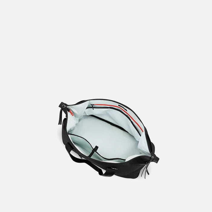 A Sherpani Boston Carbon Black Anti-theft Weekender, above view showing inside main pocket on white backdrop.   #color_carbon-black