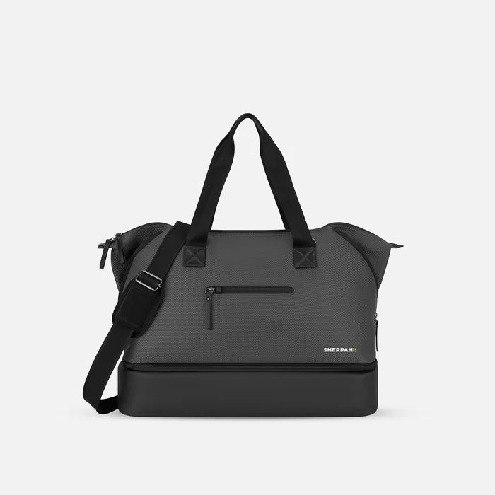 A Sherpani Boston Granite Anti-theft Weekender, front view showing front lockable zipper pocket against a white background. #color_granite-grey