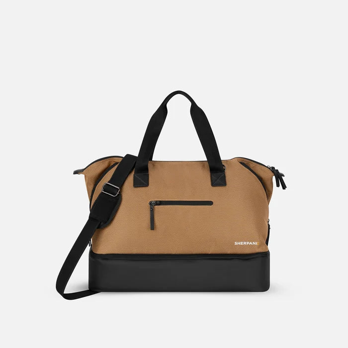 A Sherpani Boston Sand Anti-theft Weekender, front view showing lockable pocket & strap options on white backdrop.  #color_sand-tan