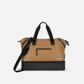 A Sherpani Boston Sand Anti-theft Weekender, front view showing lockable pocket & strap options on white backdrop.  #color_sand-tan