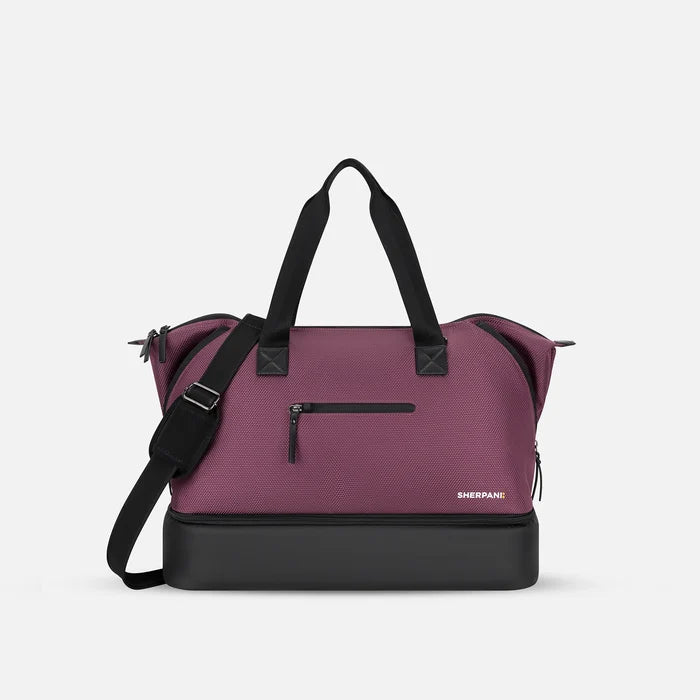 A Sherpani Boston Smoky Orchid Anti-theft Weekender, front view showing lockable pocket & strap options on white backdrop.  #color_smoky-orchid-pink