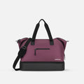A Sherpani Boston Smoky Orchid Anti-theft Weekender, front view showing lockable pocket & strap options on white backdrop.  #color_smoky-orchid-pink