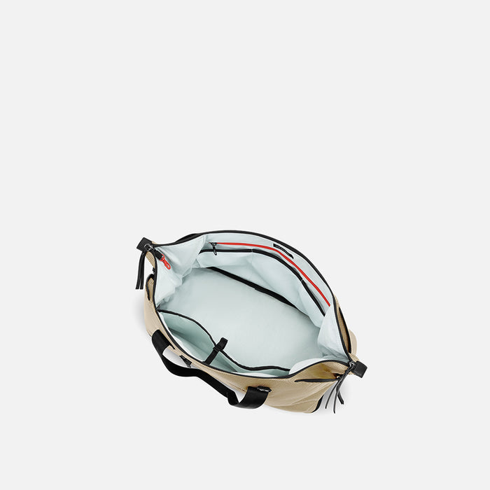 A Sherpani Boston Straw Beige Anti-theft Weekender, above view showing inside main pocket on white backdrop. #color_straw-beige