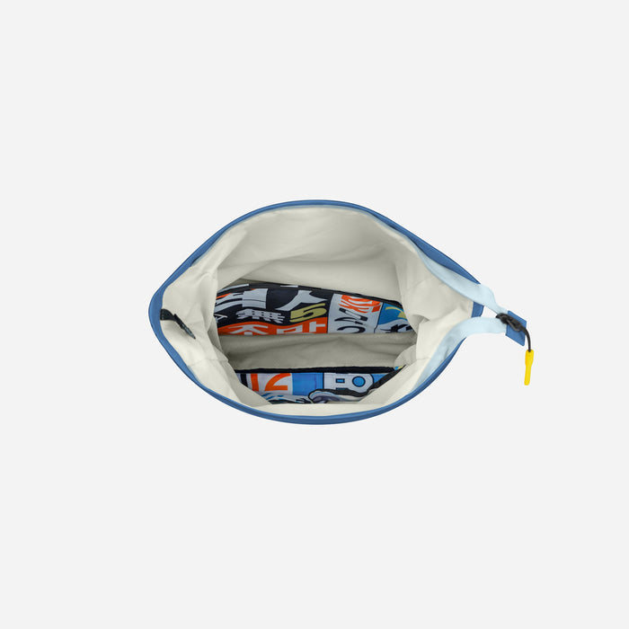 A Sherpani Cabo Seastone Day Pack, above view into the main large pocket of the bag against a white background. #color_seastone
