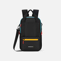A Sherpani Camden Chromatic Black Backpack, front view showing various pockets and strap options on white backdrop.  #color_chromatic-black