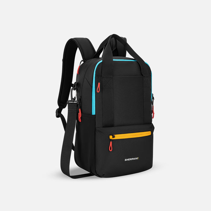 A Sherpani Camden Chromatic Black Backpack, 3/4 view showing various pockets and strap options on white backdrop.  #color_chromatic-black