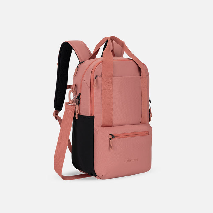 A Sherpani Camden Desert Pink Backpack, 3/4 view showing various pockets and strap options on white backdrop.  #color_desert-pink