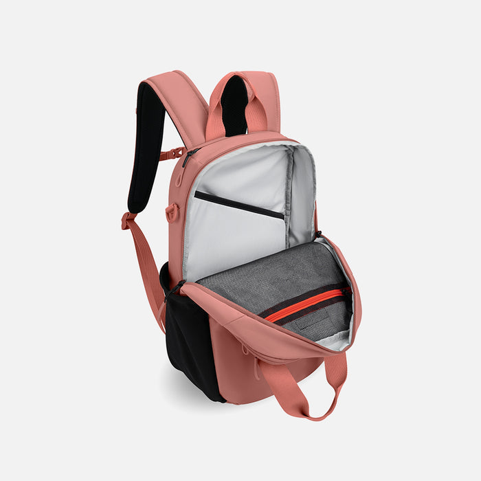 A Sherpani Camden Desert Pink Backpack, 3/4 view showing inside of main pocket on a white background. #color_desert-pink