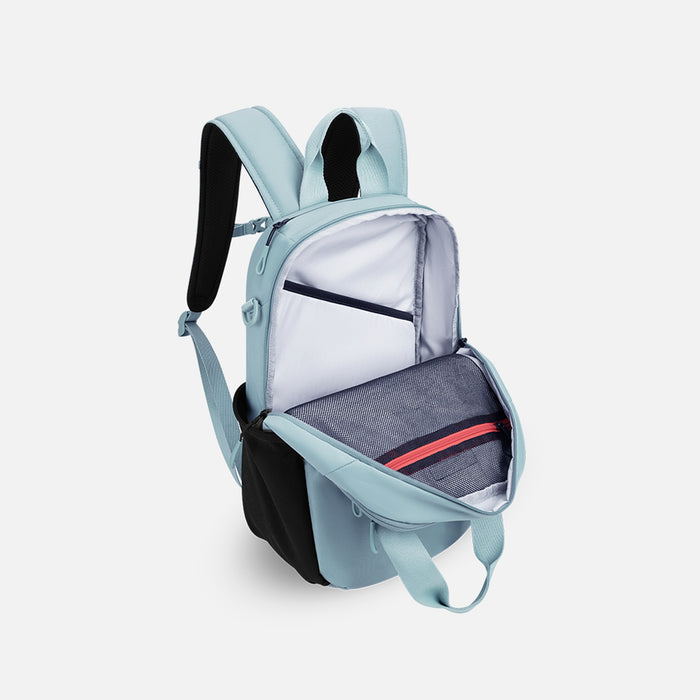 A Sherpani Camden Surf Blue Backpack, 3/4 view showing inside of main pocket on a white background.  #color_surf-blue