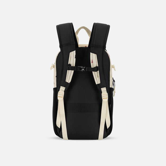 A Sherpani Camden Terrazzo Print Backpack, back view showing the shoulder strap and a luggage strap on a white background. #color_terrazzo-print