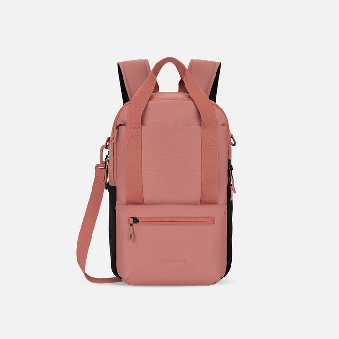 A Sherpani Camden Desert Pink Backpack, front view showing various pockets and strap options on white backdrop. #color_desert-pink