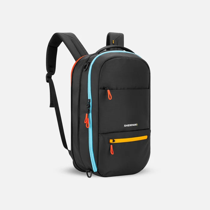 A Sherpani Camden Ciao Ultimate Backpack, 3/4 view showing unzipped extender and strap options on white backdrop. #color_chromatic-black
