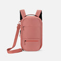 A Sherpani Camden Desert Pink Ultimate Backpack, front view showing various pockets and strap options on white backdrop.  #color_desert-pink