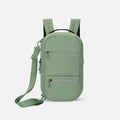 A Sherpani Camden Olivine Ultimate  Backpack, front view showing various pockets and strap options on white backdrop.  #color_olivine-green