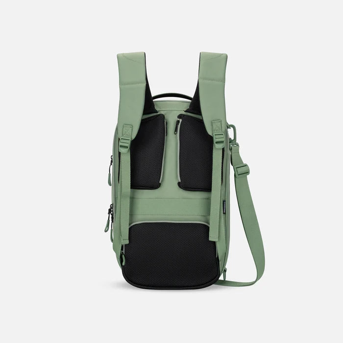 A Sherpani Camden Olivine Ultimate Backpack, back view showing shoulder straps and luggage strap on white background.  #color_olivine-green