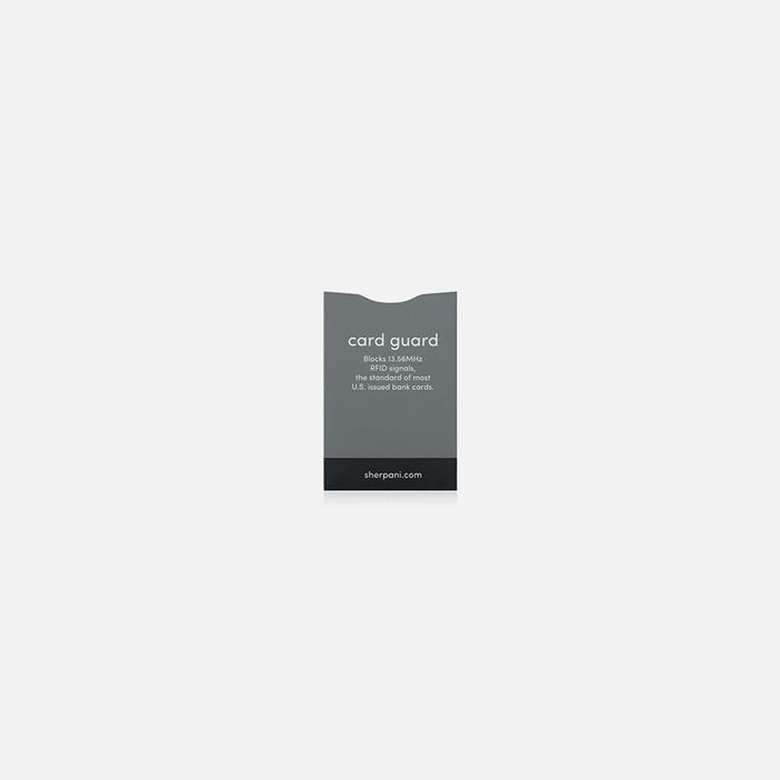 A Sherpani Passport Guard Grey RFID Sleeve on white backdrop.