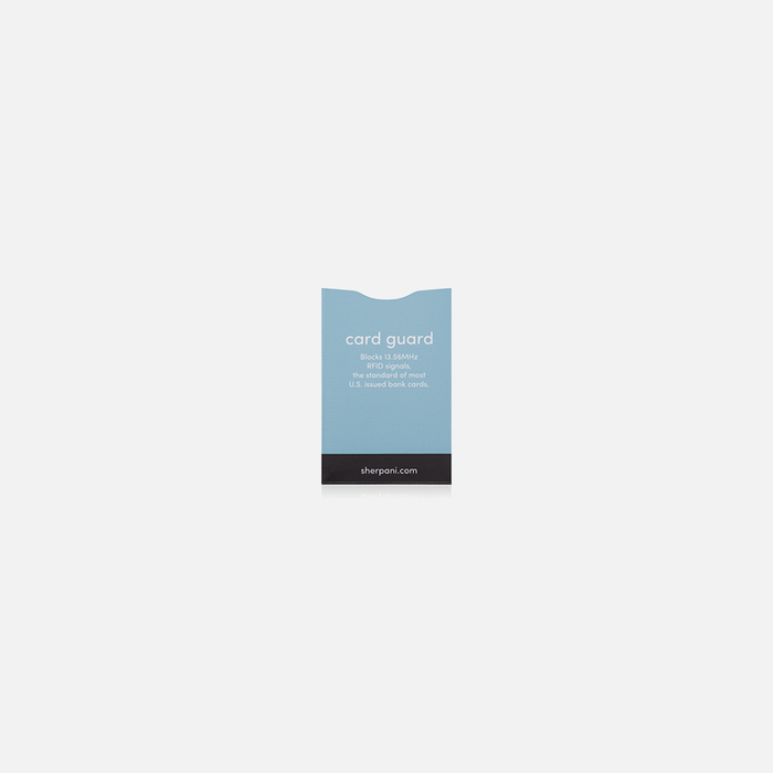 A Sherpani Passport Guard Blue RFID Sleeve on white backdrop.
