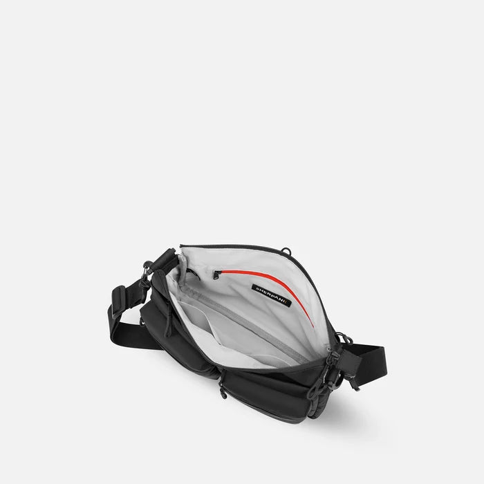 A Sherpani Ceara Raven Black Expandable Crossbody, above view showing all inside pockets on a white background.  #color_raven-black