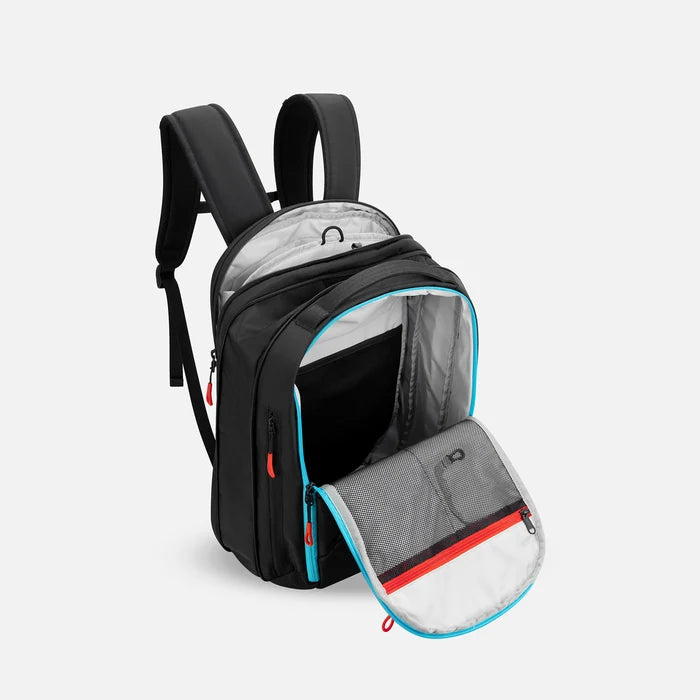 A Sherpani Crew Chromatic Black Travel Backpack, above view showing inside main and laptop pocket against a white background. #color_chromatic-black