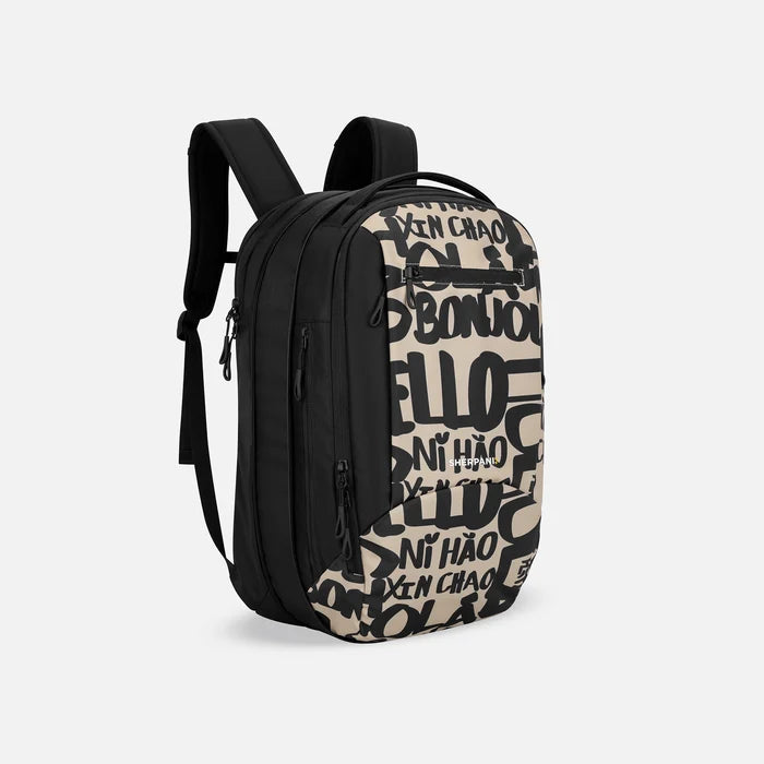 A Sherpani Crew Ciao Travel Backpack, 3/4 view showing lockable zippers and the extender pocket against a white background #color_ciao-print