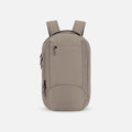 A Sherpani Crew Dune Travel Backpack, front view showing lockable zippers and different straps against a white background. #color_dune-tan