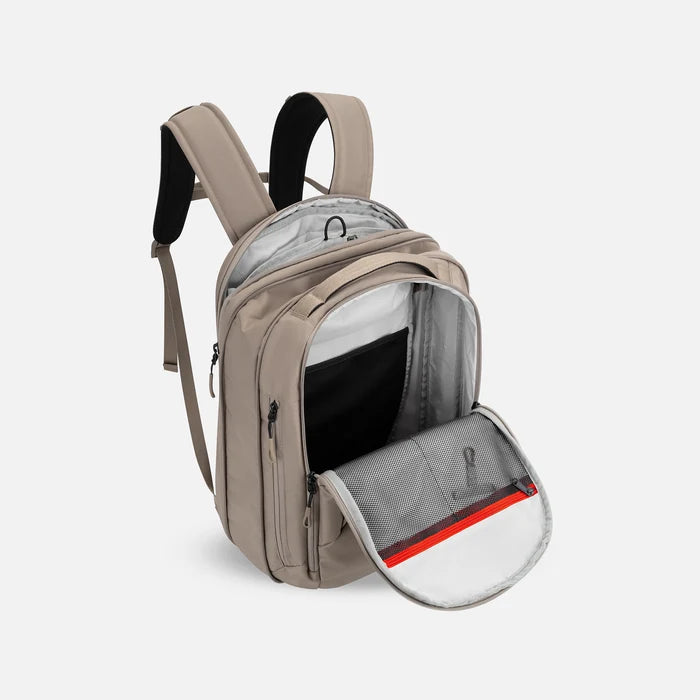 A Sherpani Crew Dune Travel Backpack, above view showing inside main and laptop pocket against a white background. #color_dune-tan