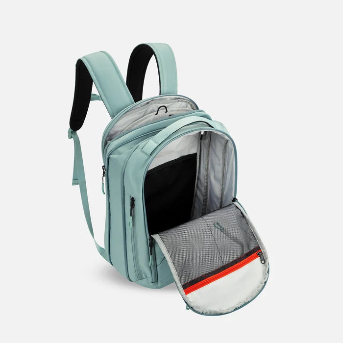 A Sherpani Crew Surf Blue Travel Backpack, above view showing inside main and laptop pocket against a white background. #color_surf-blue