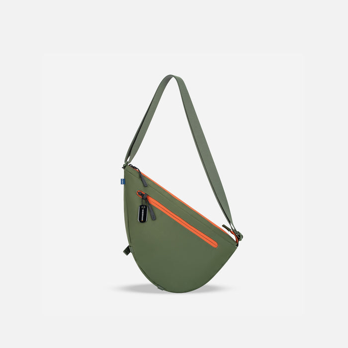 A Sherpani Cross Link Antelope Adventure Sling, back view showing lockable pocket and strap on white backdrop. #color_antelope