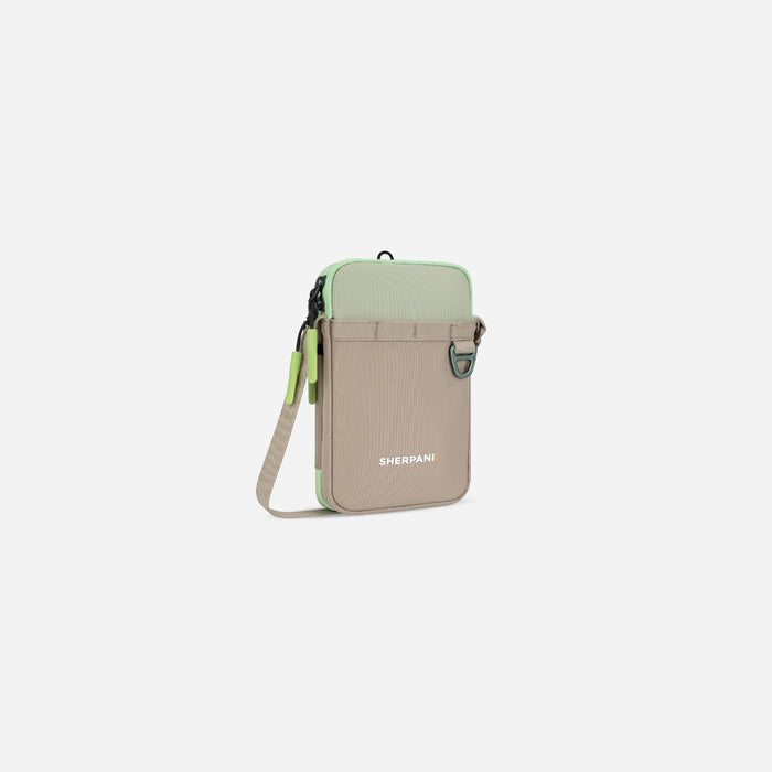 A Sherpani Cruz Desert Aloe Small Crossbody, 3/4 view showing strap and main pocket zipper on white backdrop. #color_desert-aloe