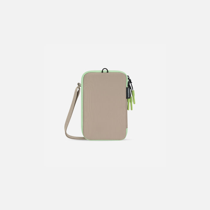 A Sherpani Cruz Desert Aloe Small Crossbody, back view showing strap and main pocket zipper on white backdrop.  #color_desert-aloe