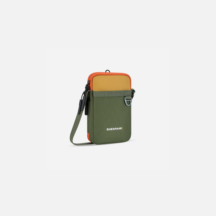A Sherpani Cruz Antelope Small Crossbody, 3/4 view showing strap and main pocket zipper on white backdrop. #color_antelope